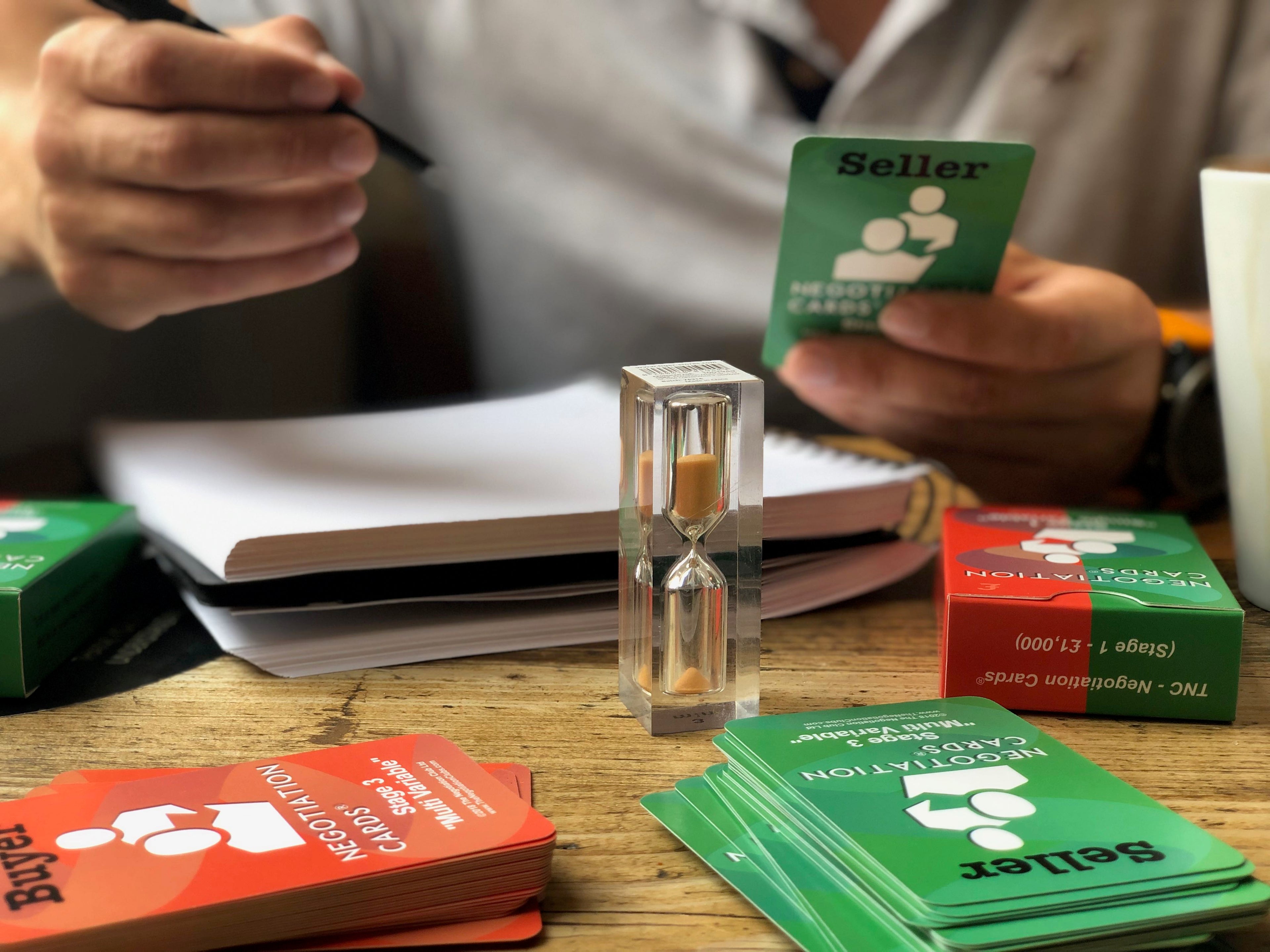 A practice negotiation with negotiation cards at a coffee shop.